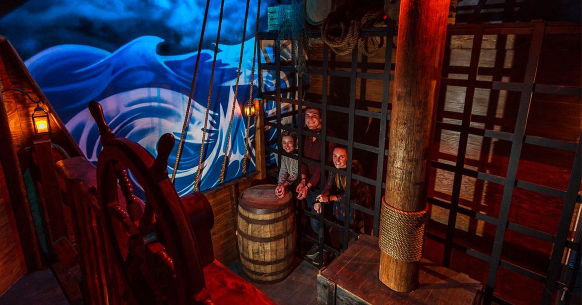 A family inside the pirate ship escape room at Escape! Whistler