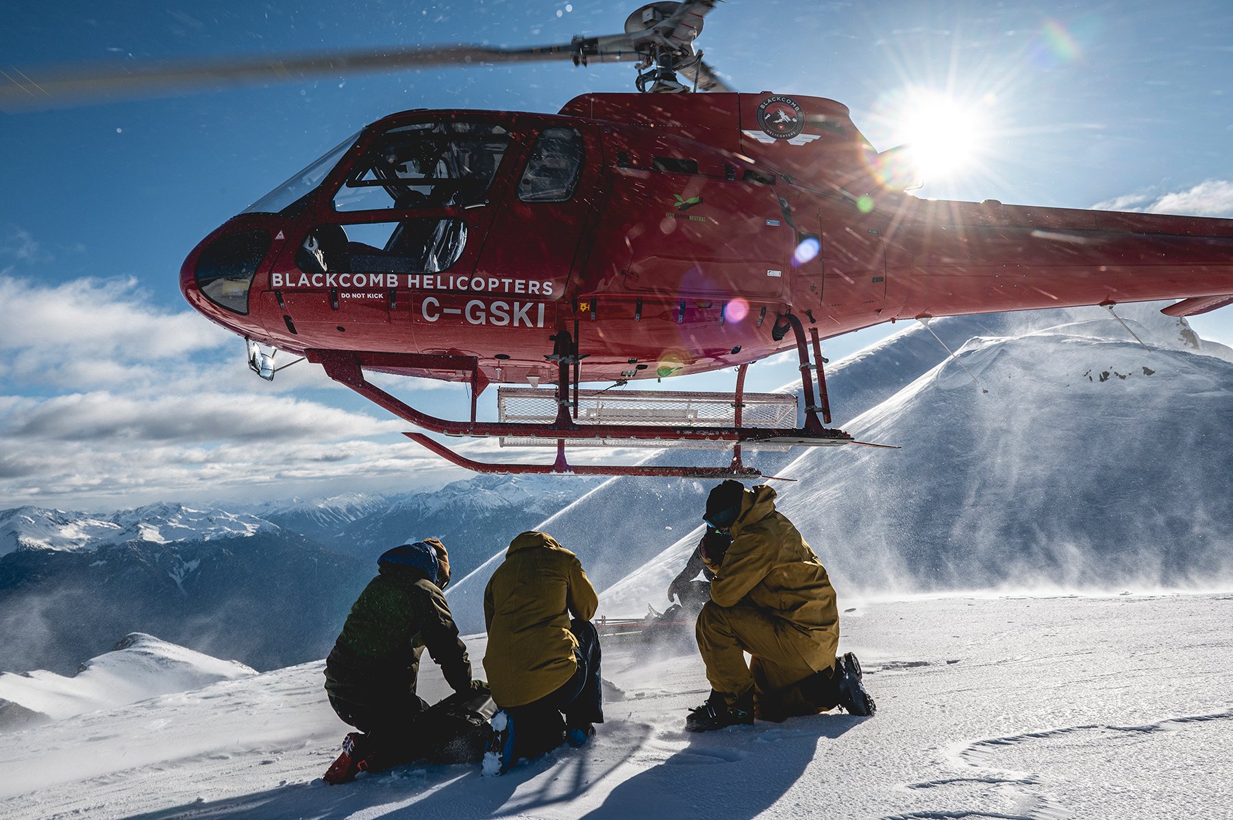 Heli-skiers on untracked powder near Whistler