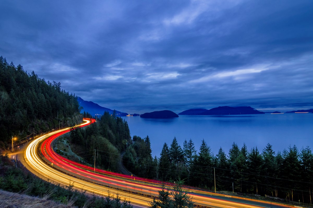 Evening traffic light trails on the Sea to Sky Highway above Howe Sound