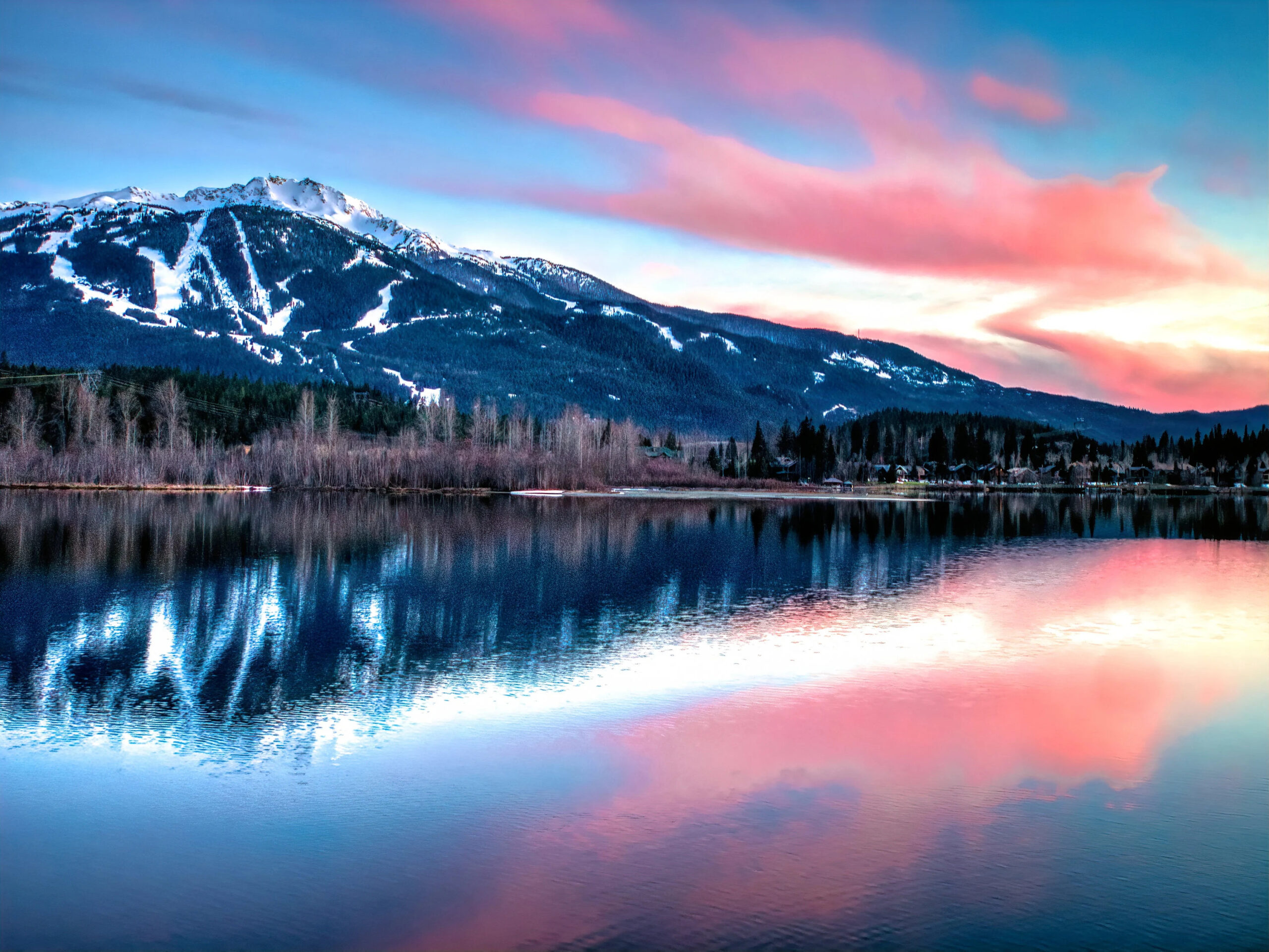 Whistler Mountain reflected in a lake at sunset