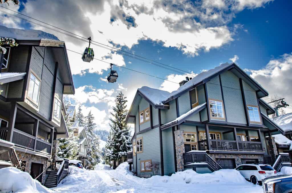 Snowy Creek townhomes in winter with the gondola overhead