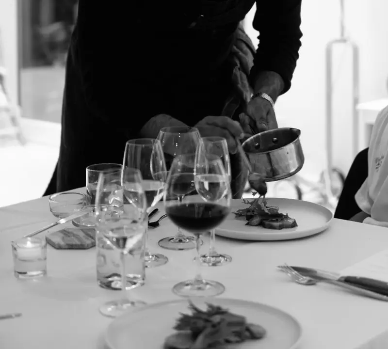A private chef plating a course at a dinner in Whistler
